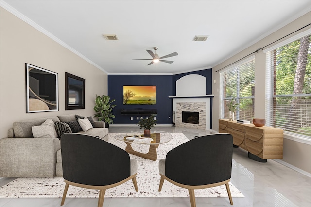 20106 Pinehaven Ln, Spring, TX 77379 - living area with baseboards, plenty of natural light, ornamental molding, a ceiling fan, and a fireplace with flush hearth