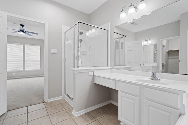12506 Emerald Springs Dr, Pearland, TX 77584 - bathroom featuring a ceiling fan, a stall shower, tile patterned floors, and vanity