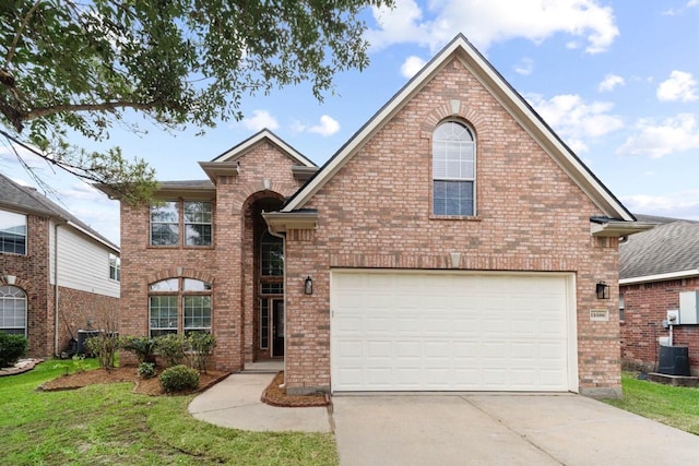 12506 Emerald Springs Dr, Pearland, TX 77584 - traditional home with driveway, brick siding, and a garage
