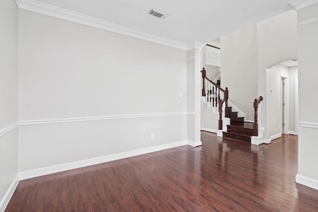12506 Emerald Springs Dr, Pearland, TX 77584 - unfurnished room featuring wood finished floors, baseboards, arched walkways, stairs, and ornamental molding