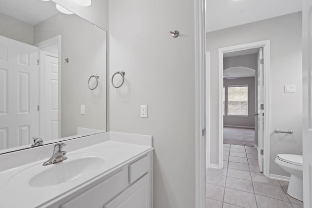 12506 Emerald Springs Dr, Pearland, TX 77584 - bathroom featuring tile patterned flooring, vanity, toilet, and baseboards
