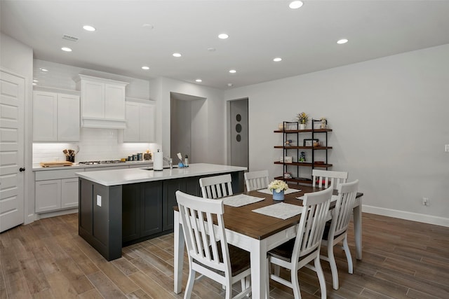 19322 Stagecoach Breeze Ln, Tomball, TX 77377 - dining room with wood finished floors, recessed lighting, and baseboards