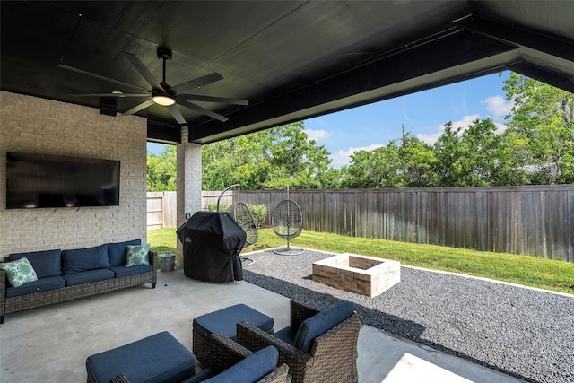 19322 Stagecoach Breeze Ln, Tomball, TX 77377 - fenced backyard featuring a patio area, a ceiling fan, an outdoor living space with a fire pit, and a grill