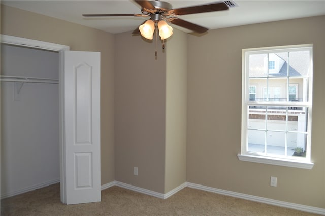 3230 Harmony Creek Ln, Spring, TX 77386 - unfurnished bedroom with light colored carpet, a closet, baseboards, and a ceiling fan