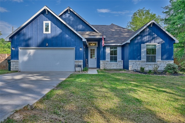 26495 Pin Oak Dr, Hempstead, TX 77445 - view of front of property featuring stone siding, board and batten siding, driveway, and a shingled roof
