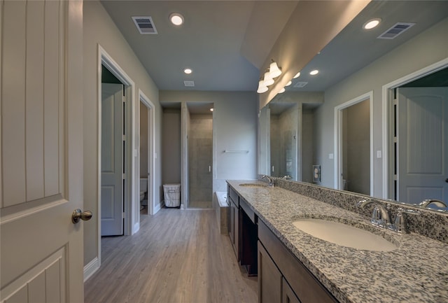 26495 Pin Oak Dr, Hempstead, TX 77445 - bathroom with toilet, baseboards, wood finished floors, recessed lighting, and a shower stall