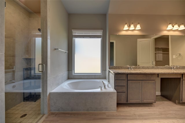 26495 Pin Oak Dr, Hempstead, TX 77445 - full bath with a stall shower, a garden tub, wood finished floors, and vanity