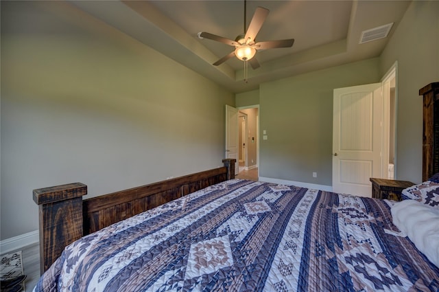 26495 Pin Oak Dr, Hempstead, TX 77445 - bedroom featuring a tray ceiling, baseboards, and ceiling fan