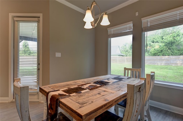 26495 Pin Oak Dr, Hempstead, TX 77445 - dining area with baseboards, ornamental molding, light wood-type flooring, and a chandelier