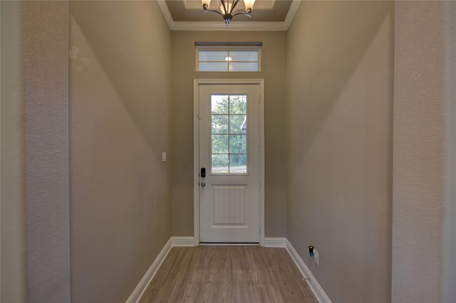 26495 Pin Oak Dr, Hempstead, TX 77445 - doorway featuring a chandelier, wood finished floors, ornamental molding, and baseboards