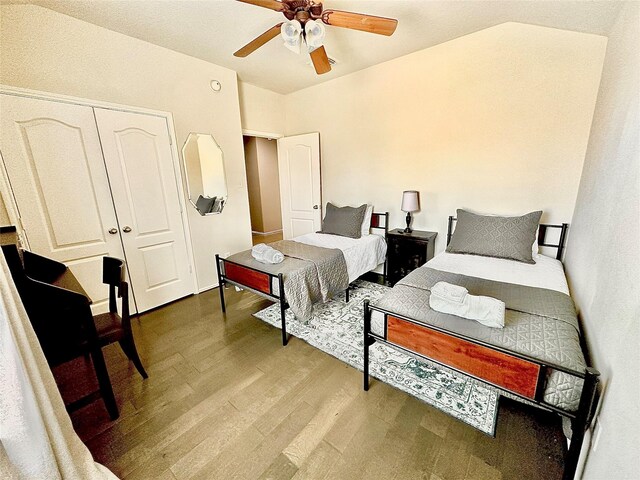 2505 Cypress Springs Ct, Pearland, TX 77584 - bedroom with wood finished floors, a ceiling fan, and a closet