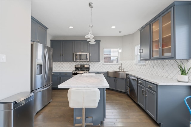 2505 Cypress Springs Ct, Pearland, TX 77584 - kitchen featuring stainless steel appliances, a sink, dark wood-type flooring, a center island, and recessed lighting