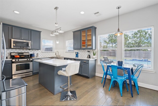 2505 Cypress Springs Ct, Pearland, TX 77584 - kitchen featuring stainless steel appliances, a sink, backsplash, light countertops, and recessed lighting