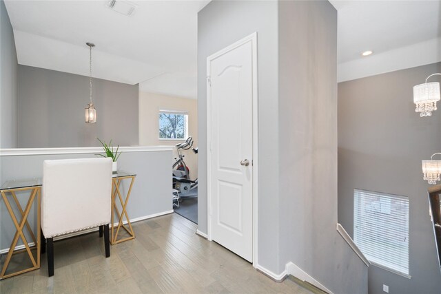 2505 Cypress Springs Ct, Pearland, TX 77584 - hall featuring a chandelier, wood finished floors, an upstairs landing, baseboards, and recessed lighting