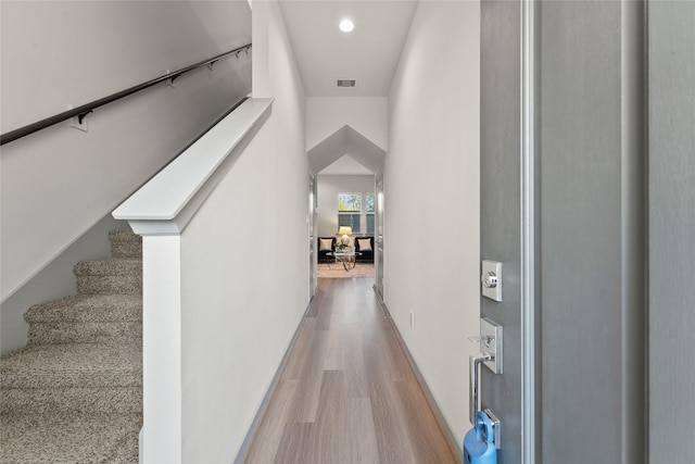 64 Dipping Ln, Houston, TX 77076 - hall featuring wood finished floors, stairway, and recessed lighting