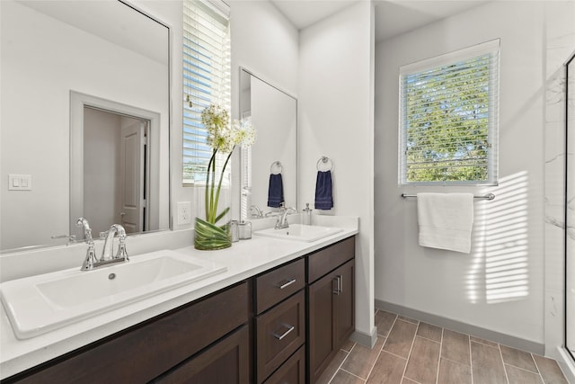 64 Dipping Ln, Houston, TX 77076 - full bath featuring healthy amount of natural light, double vanity, baseboards, and a shower stall