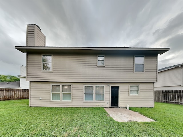 18481 Sunrise Oaks Ct, Montgomery, TX 77316 - back of property with a chimney and a patio area
