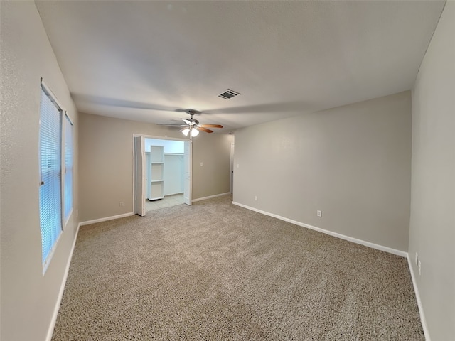 18481 Sunrise Oaks Ct, Montgomery, TX 77316 - spare room featuring ceiling fan, light colored carpet, and baseboards