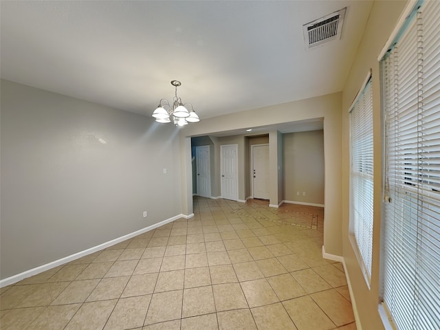 18481 Sunrise Oaks Ct, Montgomery, TX 77316 - spare room featuring a chandelier, baseboards, and light tile patterned floors