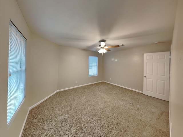 18481 Sunrise Oaks Ct, Montgomery, TX 77316 - empty room featuring carpet floors, a ceiling fan, and baseboards