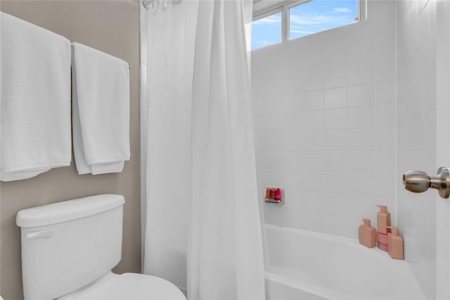 full bathroom with toilet and shower / tub combo
