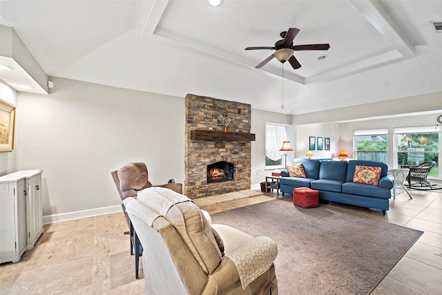 16107 York Minster Dr, Spring, TX 77379 - living room with a raised ceiling, a ceiling fan, a stone fireplace, baseboards, and recessed lighting