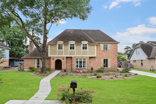 16107 York Minster Dr, Spring, TX 77379 - view of front of property with roof with shingles, stucco siding, brick siding, and central AC