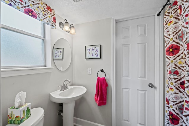 16107 York Minster Dr, Spring, TX 77379 - bathroom with a textured ceiling and toilet