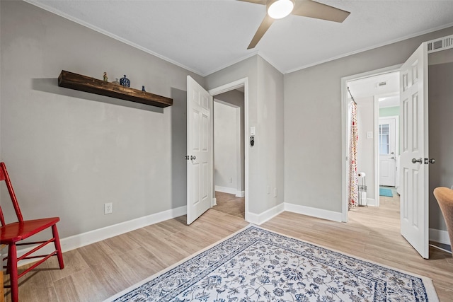 16107 York Minster Dr, Spring, TX 77379 - bedroom featuring wood finished floors, crown molding, baseboards, and a ceiling fan