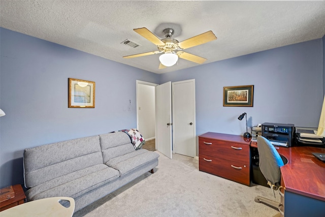 16107 York Minster Dr, Spring, TX 77379 - office with light carpet, ceiling fan, and a textured ceiling