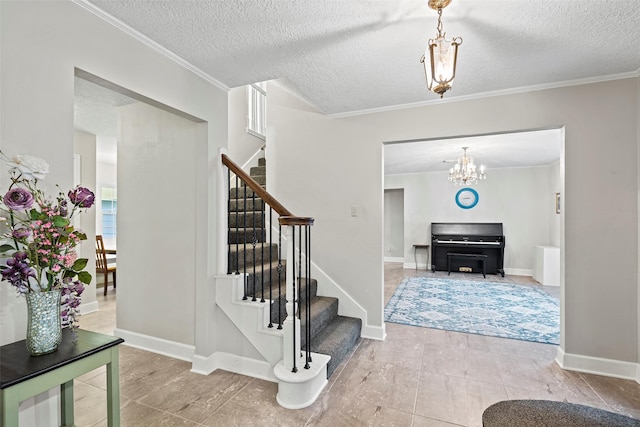 16107 York Minster Dr, Spring, TX 77379 - foyer with stairway, a textured ceiling, a chandelier, ornamental molding, and baseboards