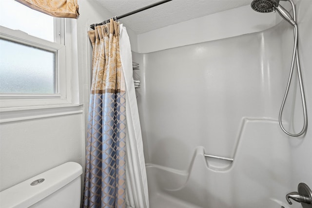 16107 York Minster Dr, Spring, TX 77379 - bathroom featuring shower / bath combination with curtain and toilet