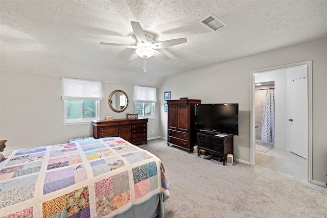 16107 York Minster Dr, Spring, TX 77379 - carpeted bedroom with a textured ceiling, baseboards, a ceiling fan, and ensuite bath