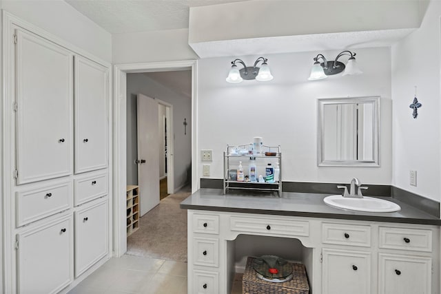 16107 York Minster Dr, Spring, TX 77379 - bathroom with tile patterned floors, a textured ceiling, and vanity