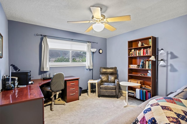 16107 York Minster Dr, Spring, TX 77379 - bedroom with light colored carpet, an office area, a textured ceiling, and a ceiling fan