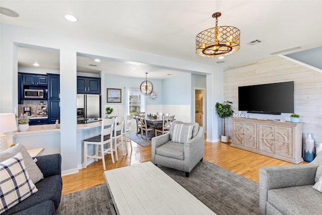 4114 Courageous Ln, Galveston, TX 77554 - living area with a chandelier, light wood-style floors, and recessed lighting