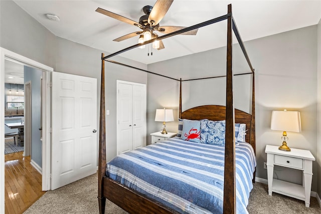 4114 Courageous Ln, Galveston, TX 77554 - bedroom with carpet, baseboards, a ceiling fan, and a closet
