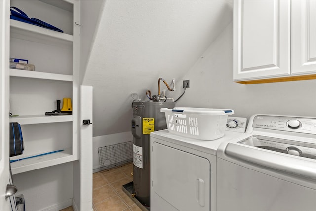 4114 Courageous Ln, Galveston, TX 77554 - clothes washing area featuring electric water heater, independent washer and dryer, cabinet space, and light tile patterned flooring