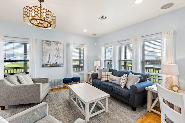 4114 Courageous Ln, Galveston, TX 77554 - living room with a chandelier, wood finished floors, and recessed lighting