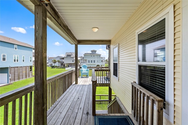 4114 Courageous Ln, Galveston, TX 77554 - wooden deck featuring a residential view and a yard