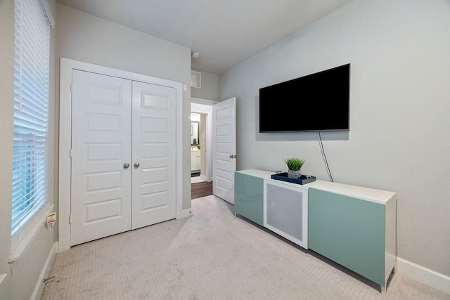 4008 Centre Glen Dr, Houston, TX 77043 - bedroom featuring light carpet, baseboards, and a closet