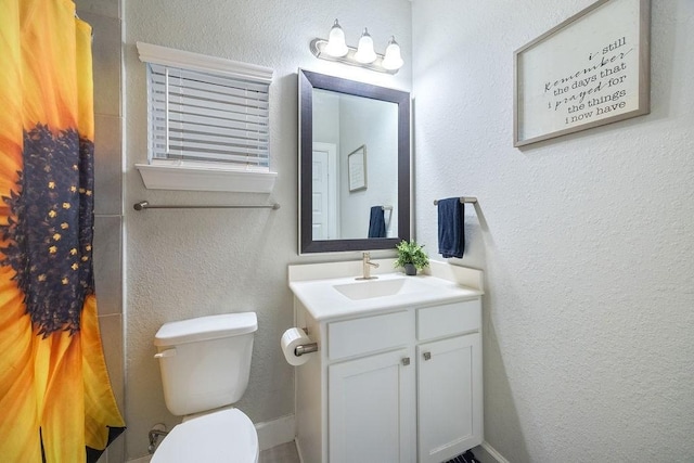 4008 Centre Glen Dr, Houston, TX 77043 - bathroom with vanity, toilet, a shower with shower curtain, and a textured wall