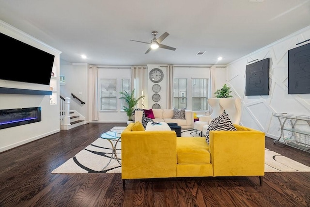 4008 Centre Glen Dr, Houston, TX 77043 - living area featuring ceiling fan, a glass covered fireplace, wood finished floors, stairs, and recessed lighting