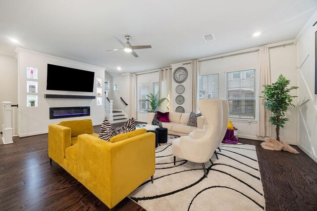 4008 Centre Glen Dr, Houston, TX 77043 - living area featuring wood finished floors, stairway, ceiling fan, a glass covered fireplace, and baseboards