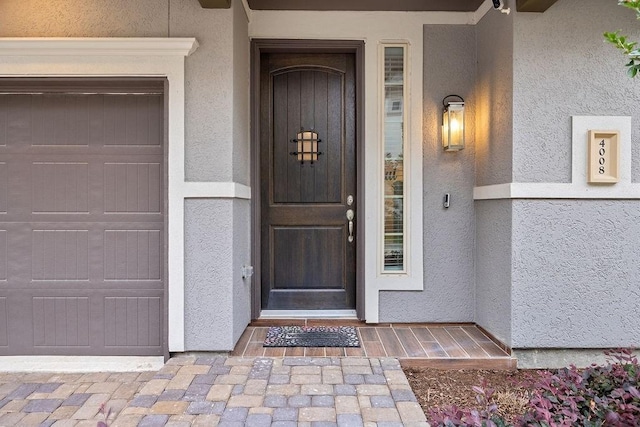 4008 Centre Glen Dr, Houston, TX 77043 - view of exterior entry featuring stucco siding and a garage
