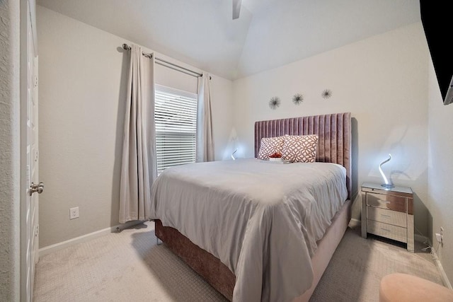 4008 Centre Glen Dr, Houston, TX 77043 - bedroom featuring light colored carpet, vaulted ceiling, baseboards, and a ceiling fan