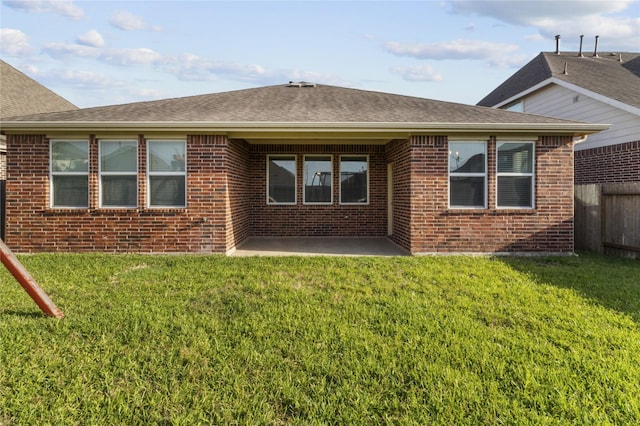 5166 Echo Falls Dr, Alvin, TX 77511 - rear view of house featuring brick siding, a patio area, and roof with shingles