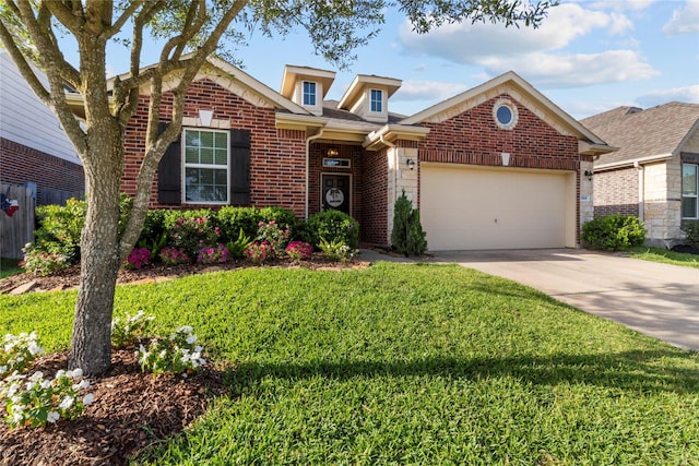 5166 Echo Falls Dr, Alvin, TX 77511 - view of front of house with brick siding, driveway, a garage, and a front lawn