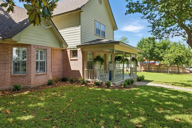407 W Main St, Brenham, TX 77833 - view of front of house featuring brick siding and roof with shingles