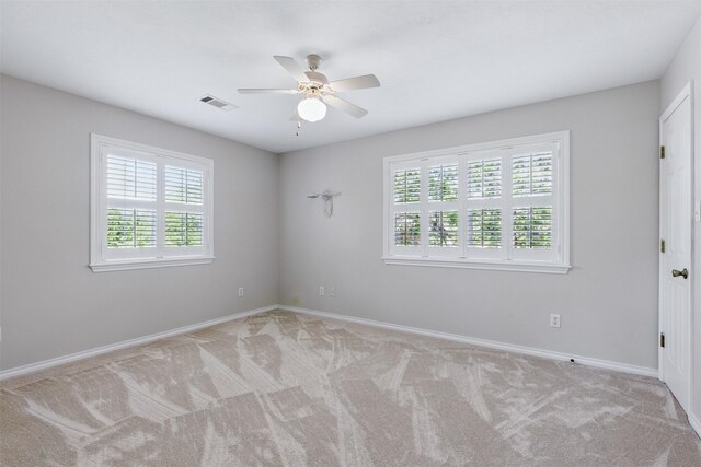 407 W Main St, Brenham, TX 77833 - unfurnished room with ceiling fan, light colored carpet, and baseboards